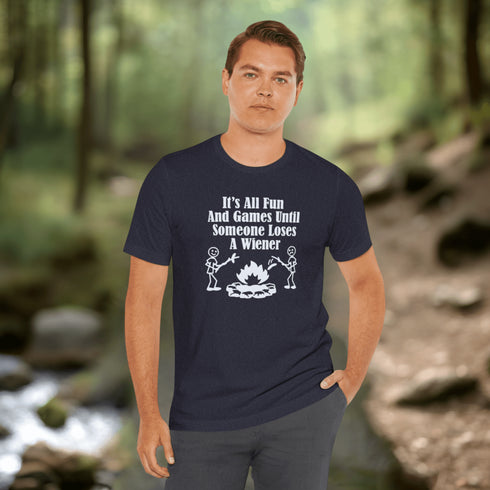 Our Camping tee features two adorable stick figure people roasting wieners over a cozy campfire. And with the hilarious slogan "It's All Fun & Games Until Someone Loses A Wiener," you'll be the life of the party at any camping trip!